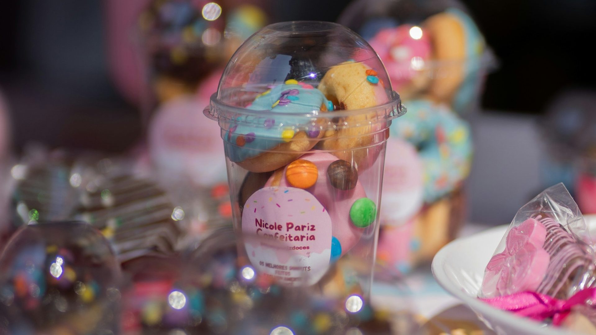 A table topped with lots of cupcakes covered in frosting